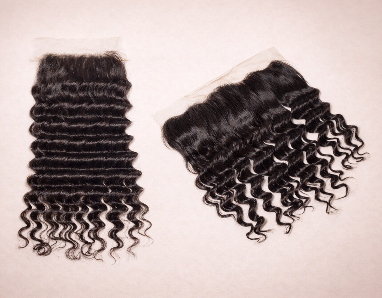 Two sets of curly hair extensions on a beige background