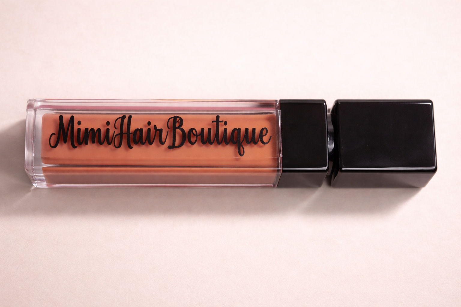 Hair product with 'Mimi Hair Boutique' branding on a light background
