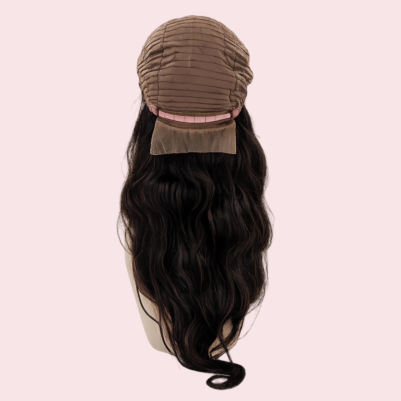 Black wig with a brown cap on a pink background